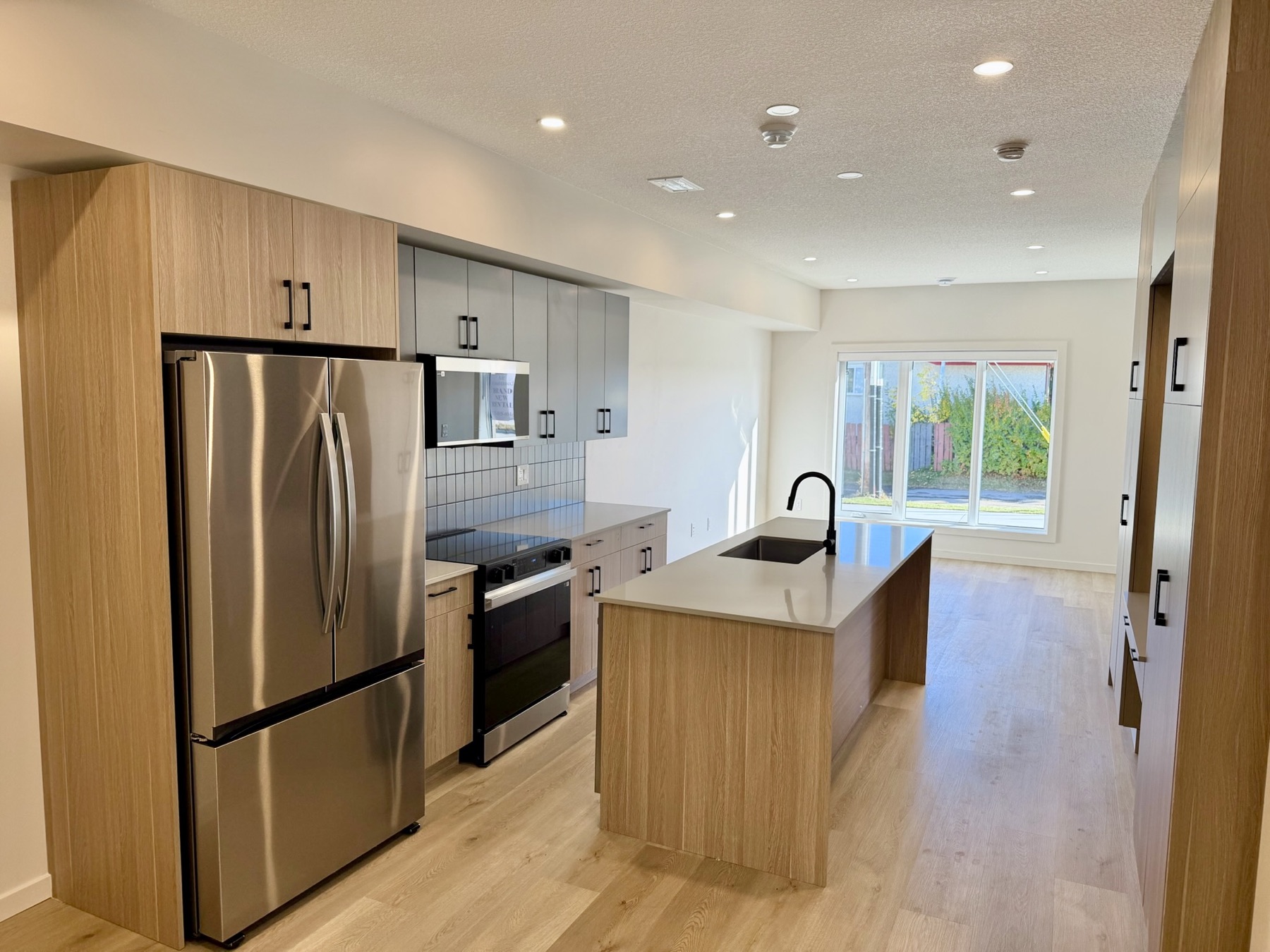 Kitchen with island and stainless steel appliances