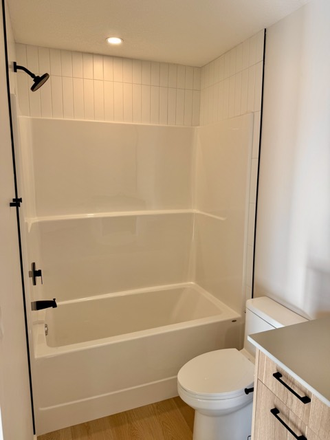 Bathroom with tub and shower